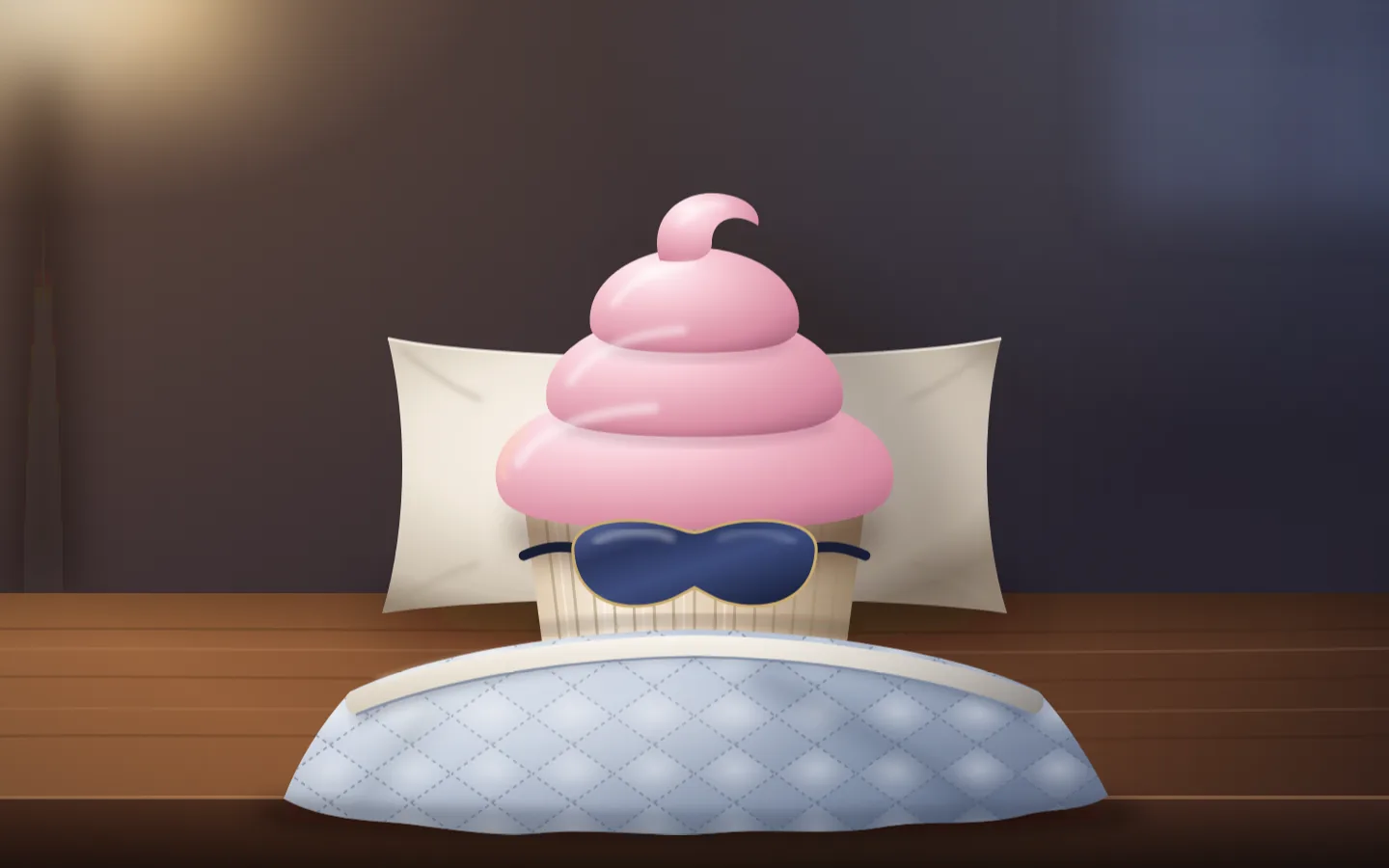 A cupcake wearing a satin sleep mask, tucked under a small quilted duvet on a bedside table